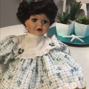 Poutin baby blue eyed porcelain doll